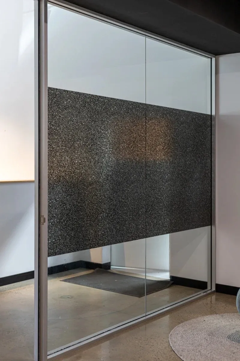 Patterned privacy band on an office glass partition