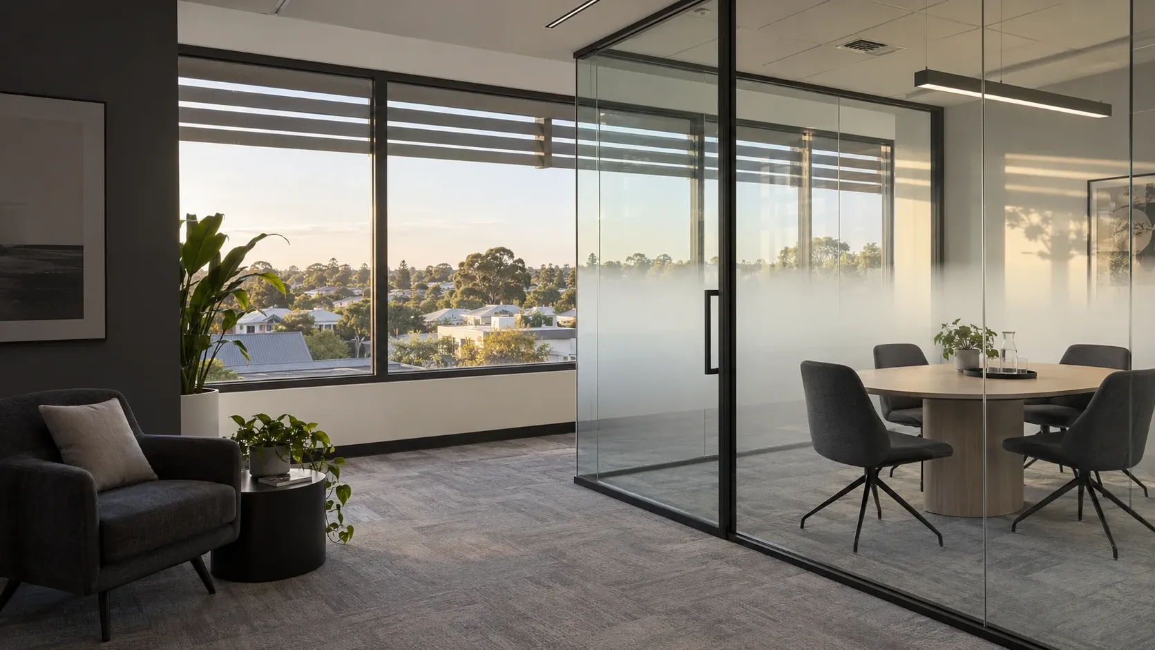 Architectural concept of gradient privacy film in a low-rise office overlooking neighbourhood rooftops
