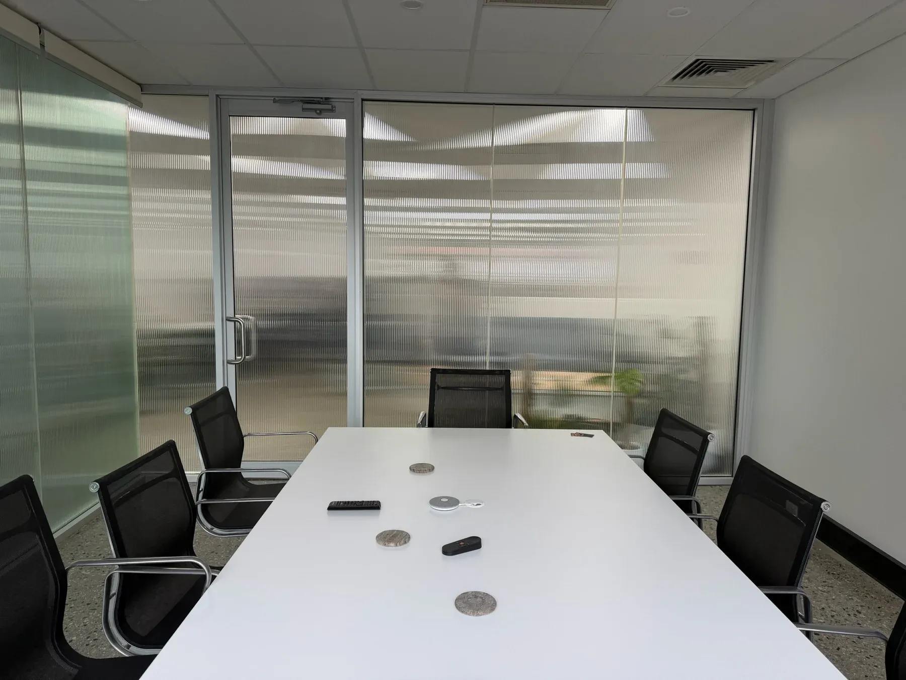 Reeded window film fitted to an existing meeting-room glass partition